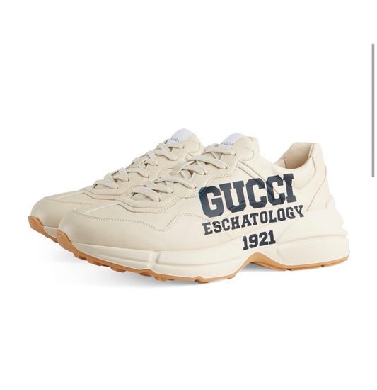 The Gucci Eschatology Rhyton leather sneaker with "Gucci Eschatology 1921" and "25" script.
